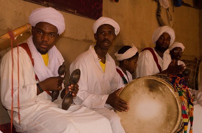 a group of men playing instruments in a room